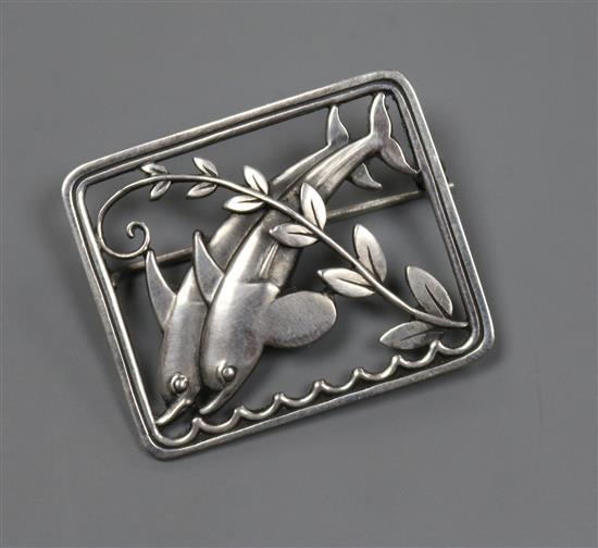 A Georg Jensen sterling silver twin dolphin and scrolling leaf branch rectangular brooch, no. 251, 37mm.